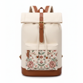 Cream canvas roll-top women's travel backpack with embroidered pocket on white background