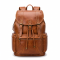 Tan genuine leather vintage men's travel backpack on white background