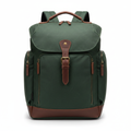 Forest green waxed canvas men's travel backpack on white background