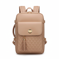 Beige quilted faux leather women's travel backpack on white background